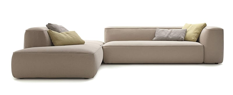 Beige sectional sofa with colorful cushions.