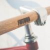 Bicycle handlebar with "Futura" logo branding.