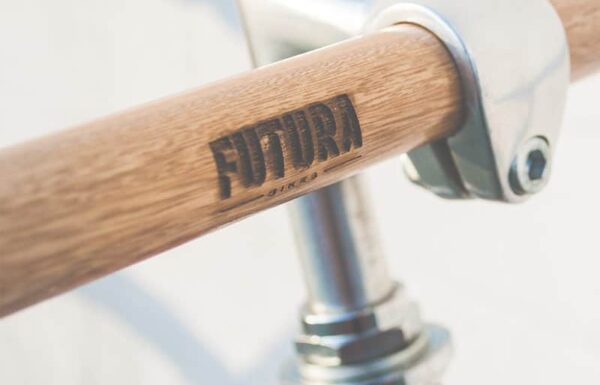 Bicycle handlebar with "Futura" logo branding.