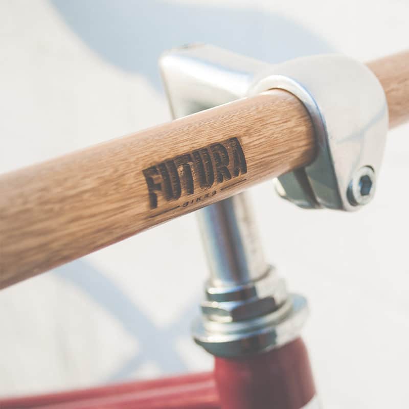 Bicycle handlebar with "Futura" logo branding.