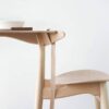 Minimalist wooden chair and table set.