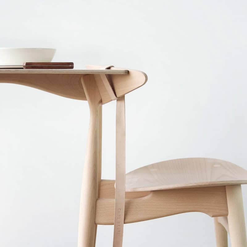 Minimalist wooden chair and table set.