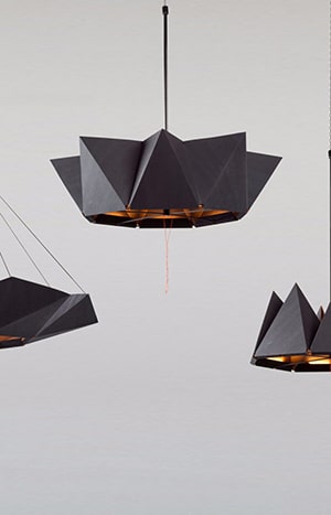 Black geometric pendant lights hanging indoors.