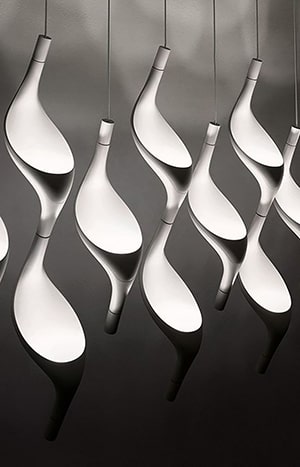 Modern hanging lights with curved design.