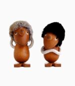 Wooden figures with fluffy hats and scarves.
