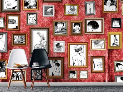 Red wall with framed black-and-white illustrations.