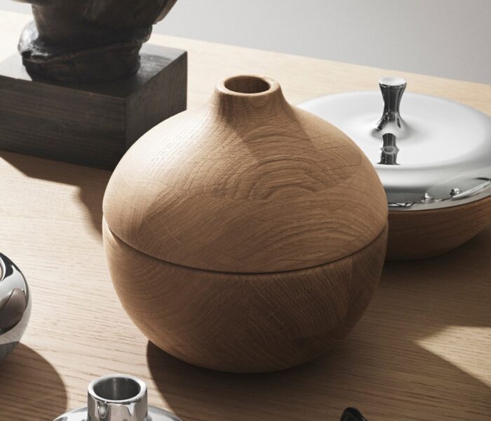Wooden and metal objects on wooden table.