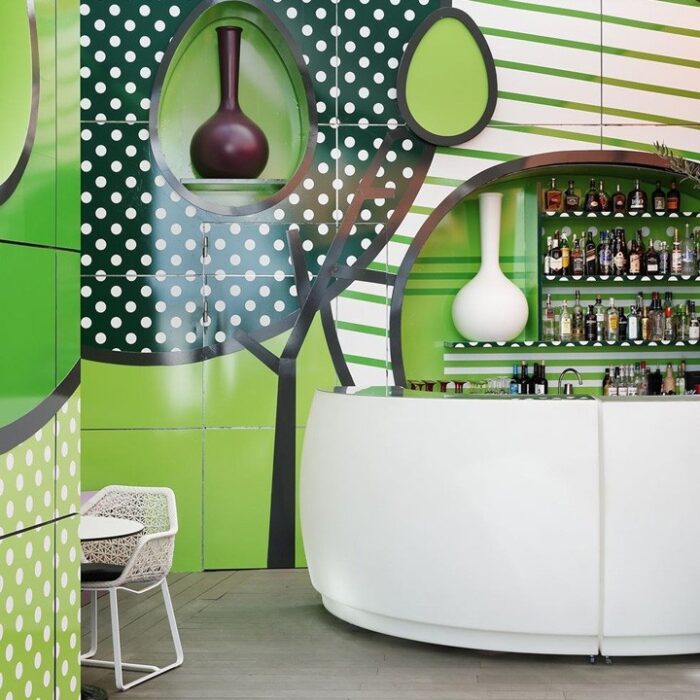 Modern bar with vibrant green decor.