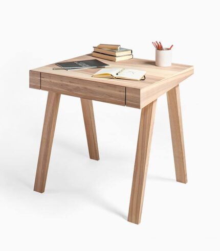 Wooden desk with books and stationery.