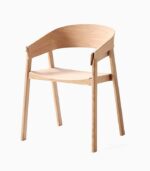 Wooden chair with curved backrest and armrests.